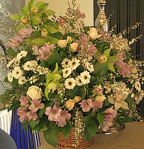 Wedding gift flowers arrangement made of  cymbidium orchids, alstroemeria, santini, tross, genista